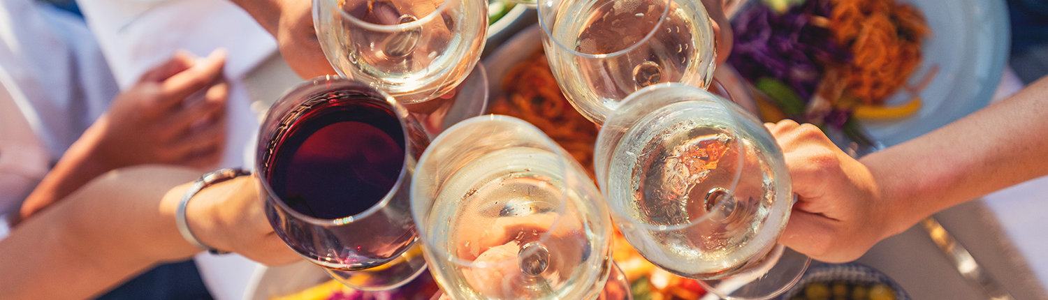 Six people toasting with wine